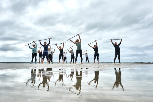 Gruppe am Wattstrand, die Sport macht Gruppe am Wattstrand, die Sport macht